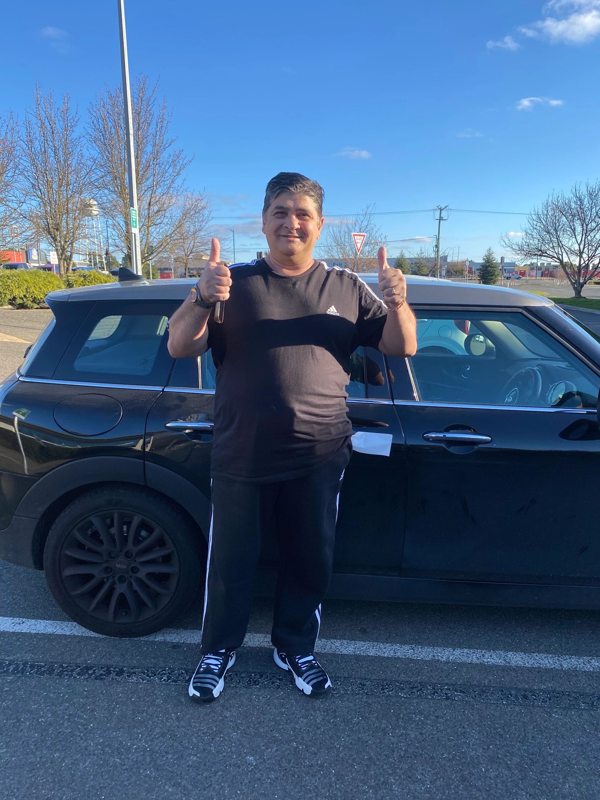 Student celebrating passing driving test